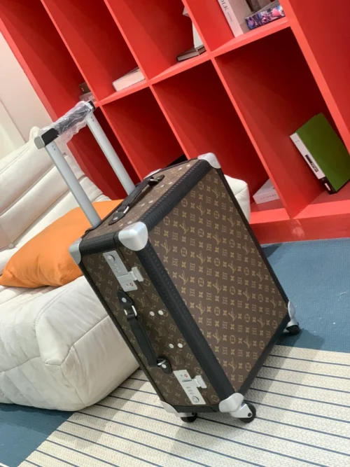 LOUIS VUITTON Rolling Trunk is made of Monogram canvas and leather